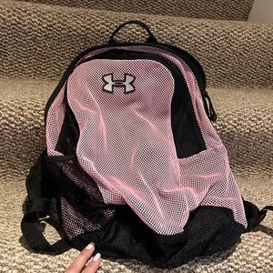 Under armor breathable back pack with a attached cover for rain.